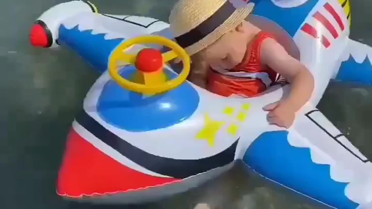 Cute baby sleeping while he playing in the sea