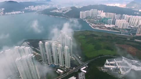 Drone in clouds with City view