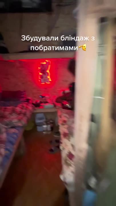 Ukrainian soldier shows his dugout