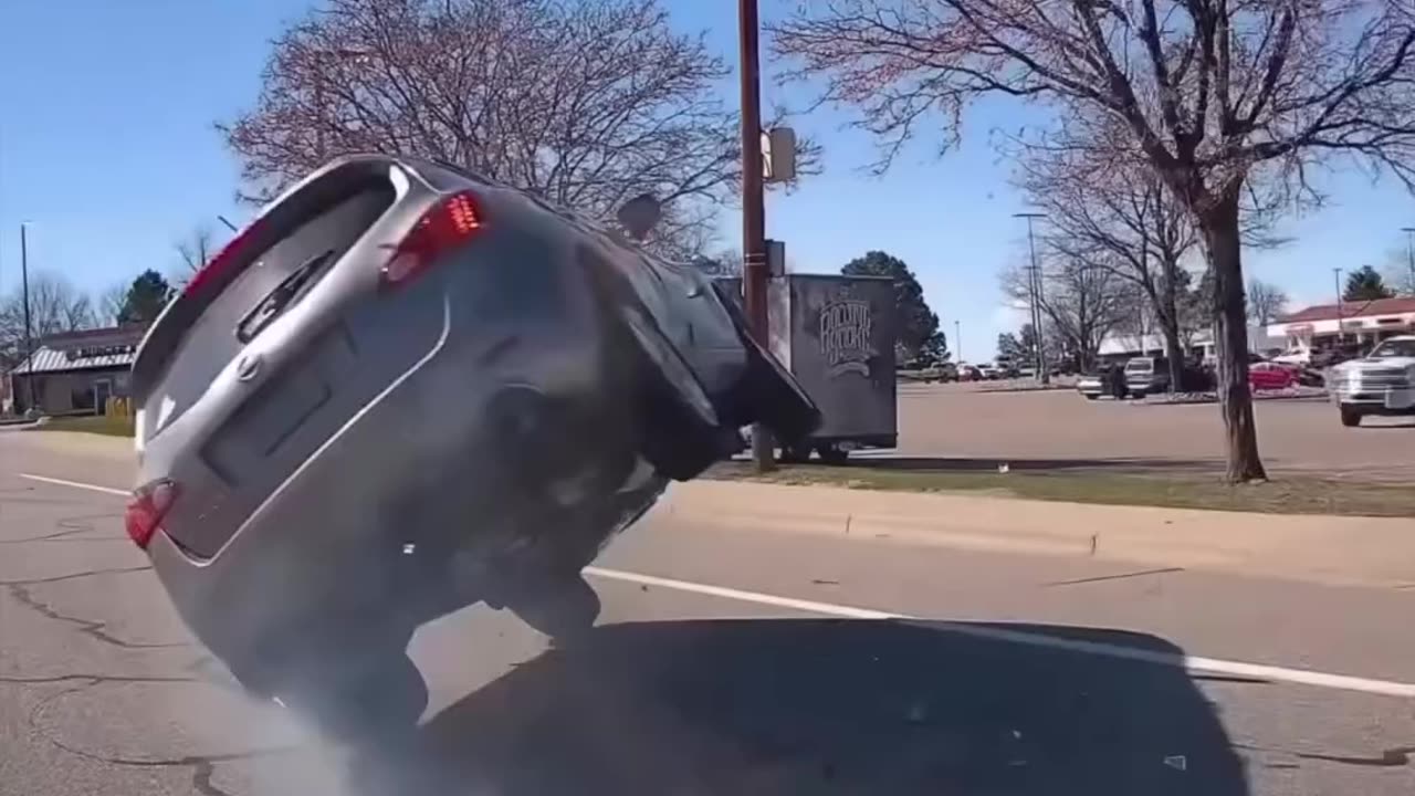 Aurora, Colorado: Vehicle causes crash after running red light.