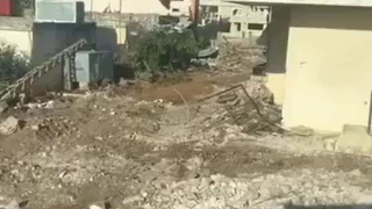 Israeli soldiers destroying homes in southern Lebanon and celebrating the demolition