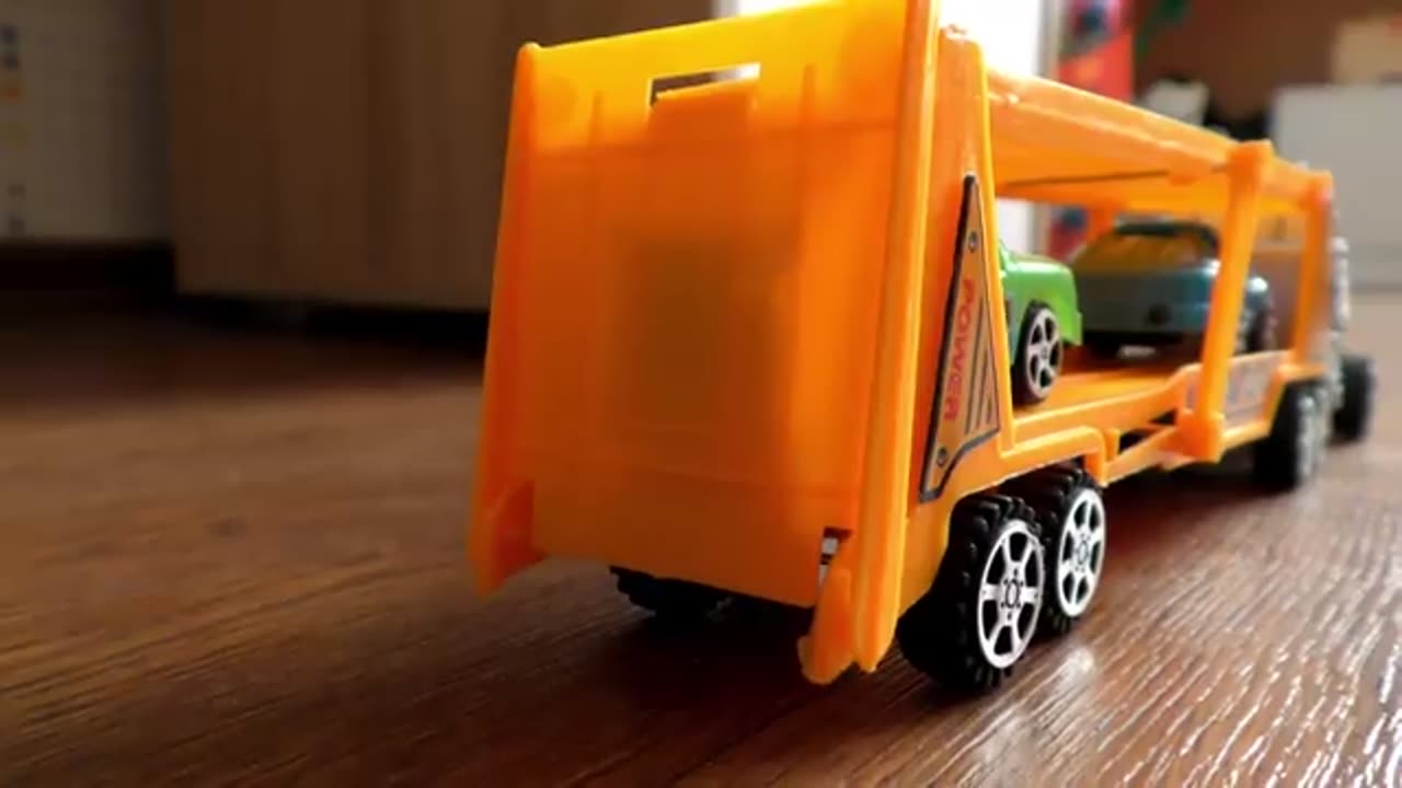 Video About Plastic Toy Cars Being Carried By Transportation Vehicles