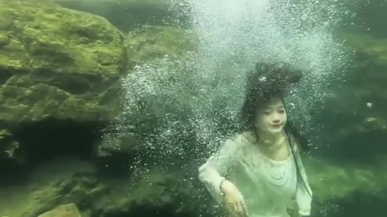 Amazing Girl Jumping Under Water