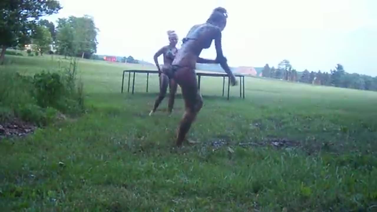 Cute girls mud wrestling in bikinis.