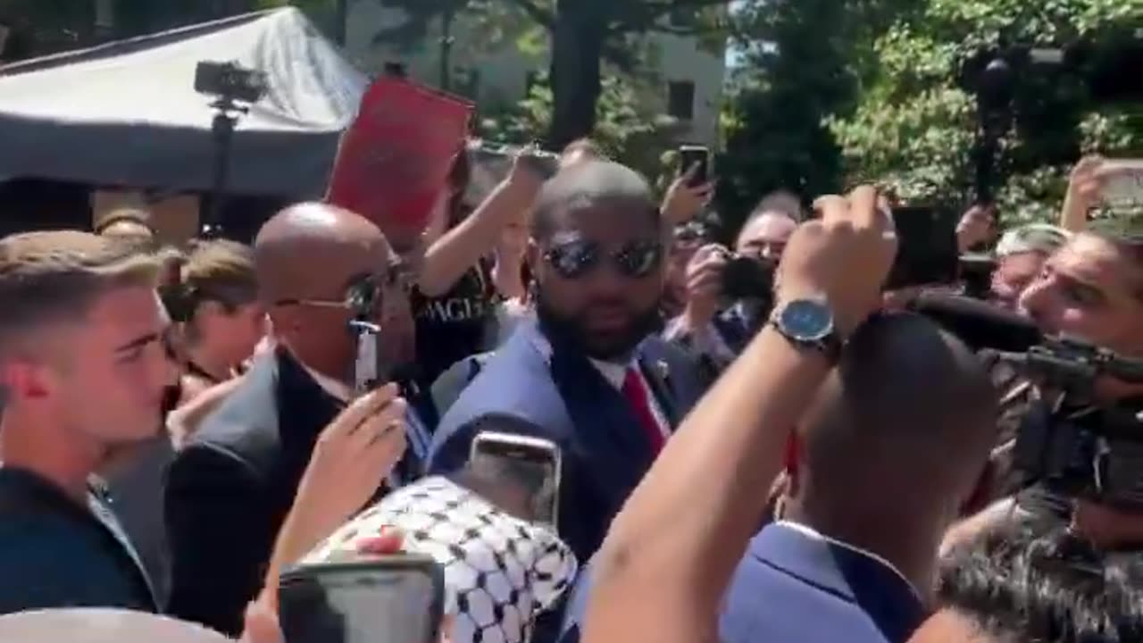 Watch Byron Donalds' response to protester calling him "race traitor," "Uncle Tom"