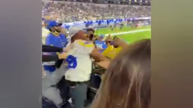 Sport Fans spank a man for getting out of control during the game