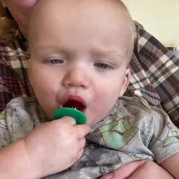Twin tries a ring pop for the first time. Adorable