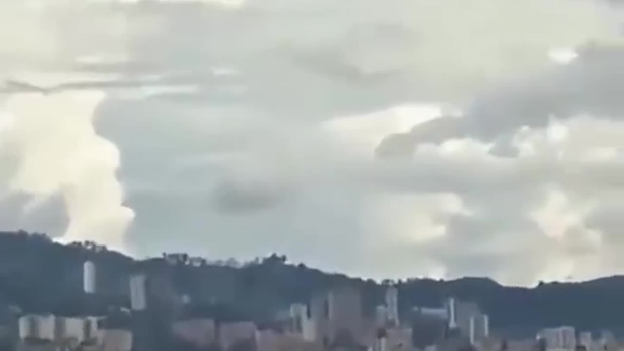 A person captures from his home a strange object in static over the city