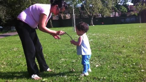 Adorable baby girl learning how to walk