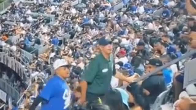 A SMART KID ABOUT TO BE KICKED OUT OF BASE BALL GAME