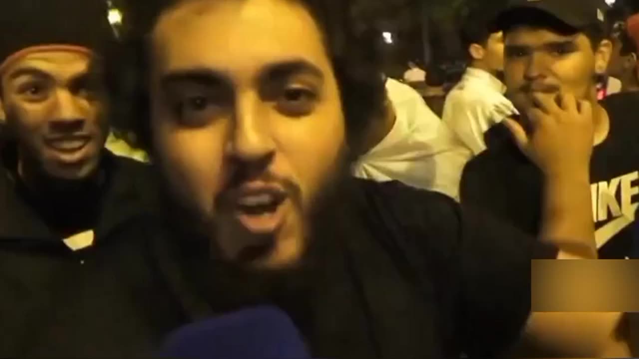 Migrants in paris France threaten le pen saying "we are here to stay