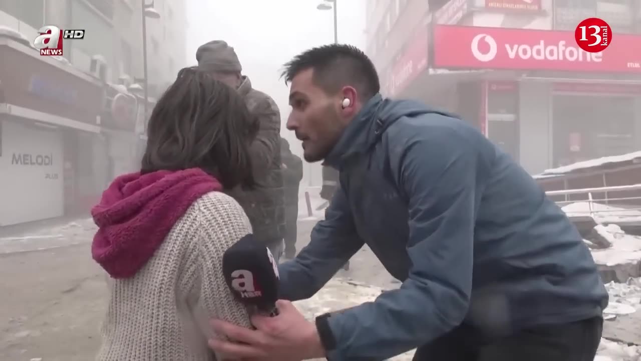 PEOPLE RUNNING AWAY AS A BUILDING COLLAPSES DURING A SECOND EARTHQUAKE...