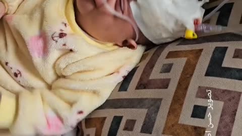 The child "July Hassan Abu Assi" is 5 months old, has a hole in the heart