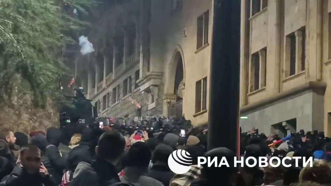 GEORGIAN PROTESTERS THROW FIRECRACKERS AND FACE OFF WITH WATER CANNONS IN TBILISI