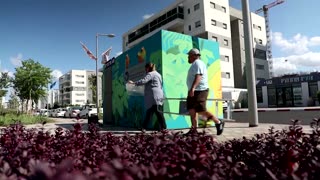 Artist couple brighten up Israeli bomb shelters