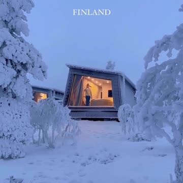 Frozen Wonderland: A Breathtaking View of an Ice-Encased Finnish Cabin"