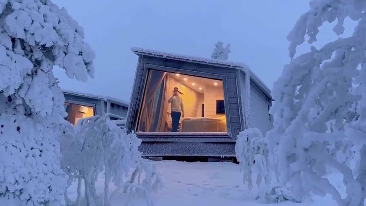 Frozen Wonderland: A Breathtaking View of an Ice-Encased Finnish Cabin"