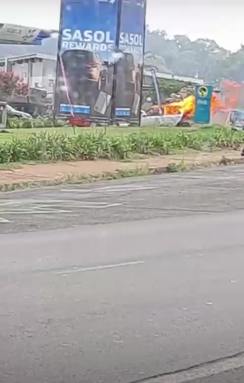 Burning vehicle crashes into petrol station