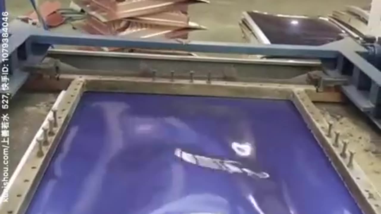 Suitcase making. The process is called thermoforming.