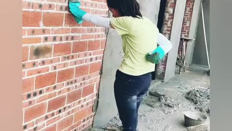 Young girl with great cement mortar skills-Great engineering in construction