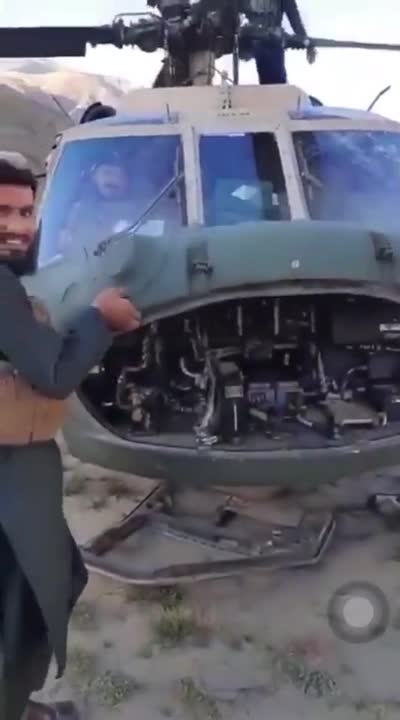 Taliban Fighters Playing with a Helicopter
