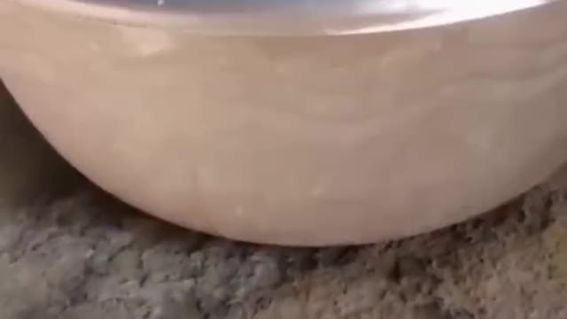 A simple free energy demonstration of how a vortex shaped surface can propel itself on moving water