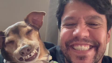 Man Laughs Along With Dog's Toothy Grin