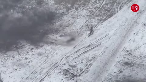 Russian soldier abandons wounded fellow soldier whom he had been dragging on snow and flees