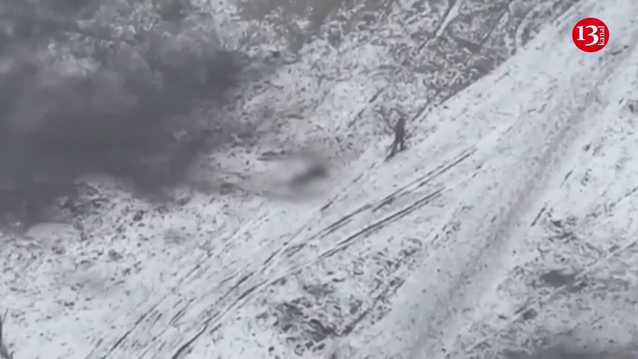 Russian soldier abandons wounded fellow soldier whom he had been dragging on snow and flees