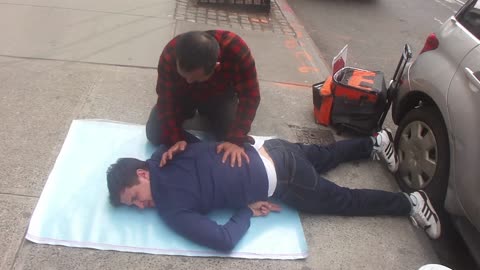 Luodong Massages White Man In Blue Shirt On Sidewalk