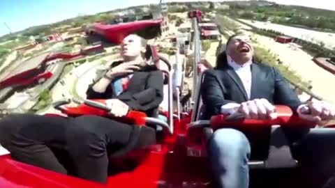 Funny people, you will never guess what this guy hits while on a rollercoaster