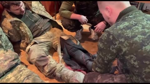 Russian medics provide medical care to Ukrainian prisoners of war.