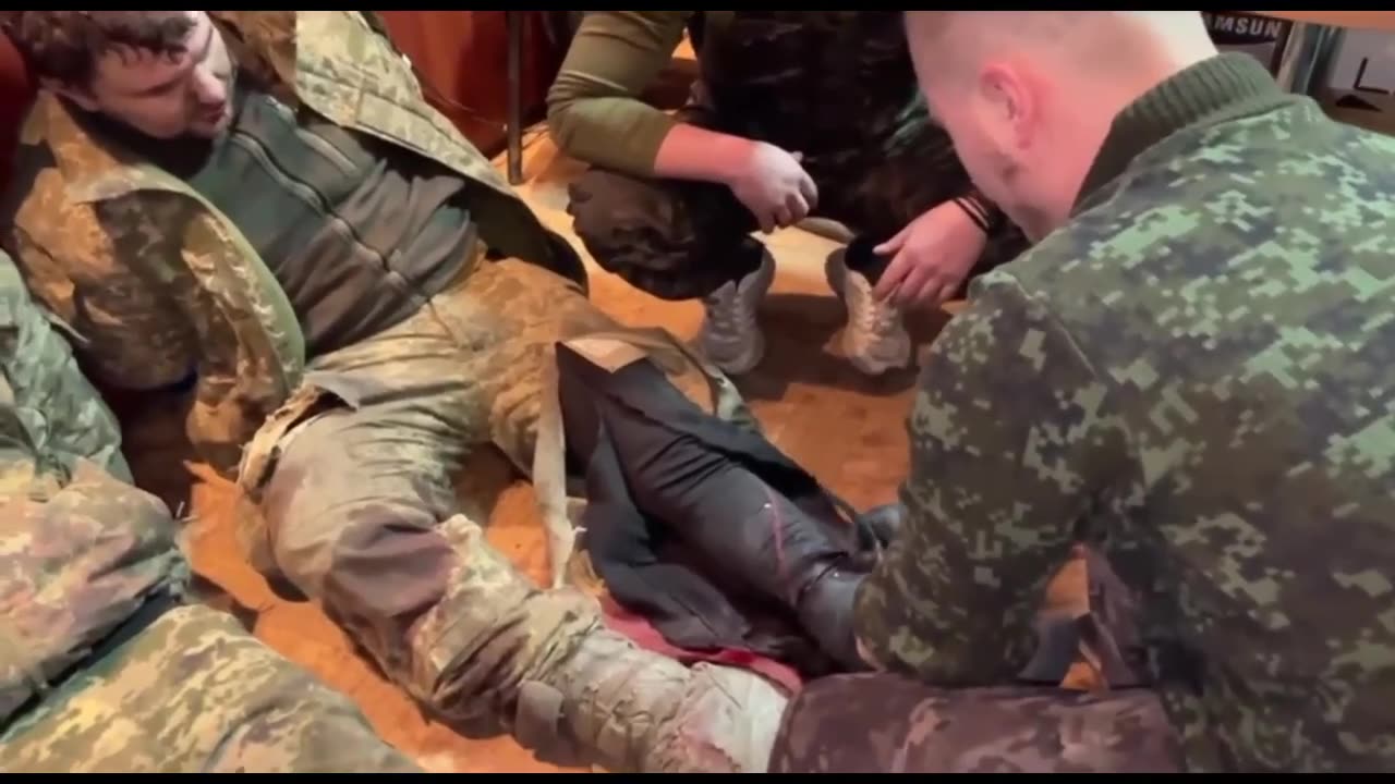 Russian medics provide medical care to Ukrainian prisoners of war.
