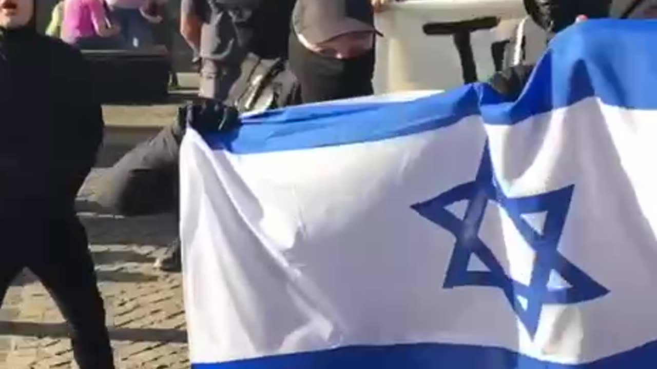 “Antifa waving the flag of their masters“