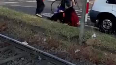 A business owner tries to deal with climate activists blocking a road in Cologne, Germany.