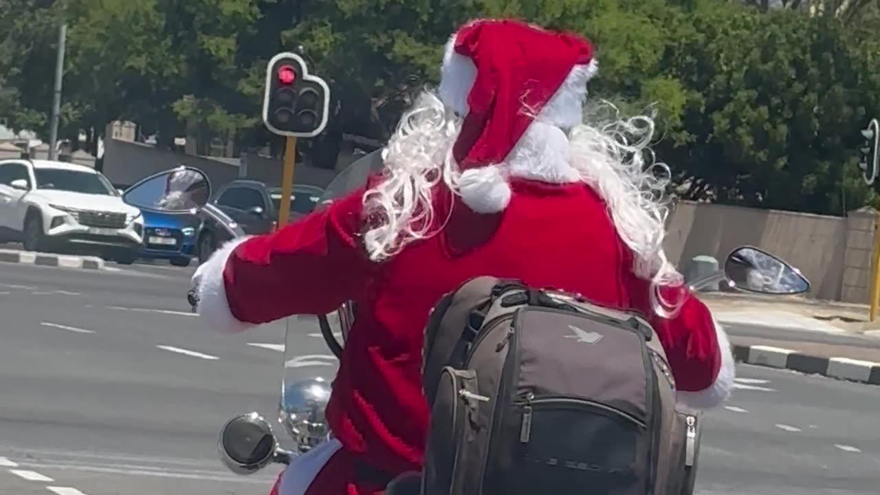 Santa Rides a Motorcycle Through Cape Town