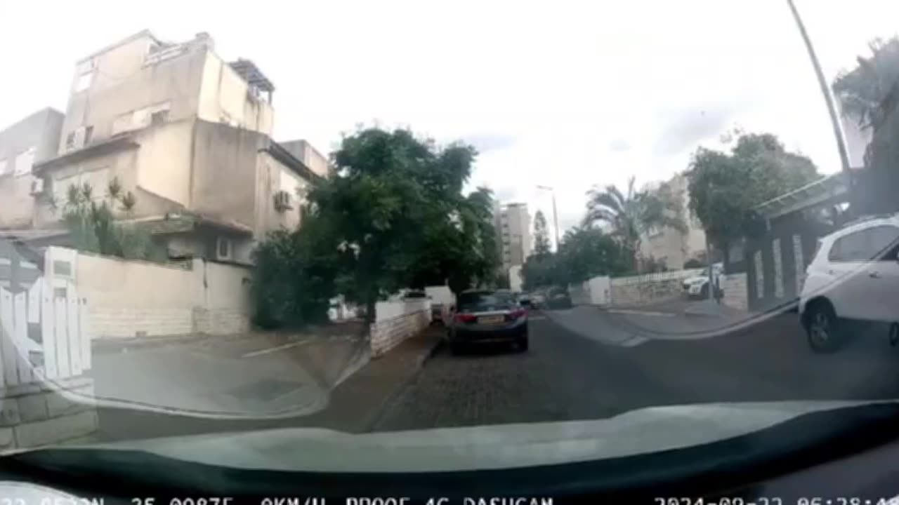 Dashcam footage shows the moment of the Hezbollah rocket impact in the Haifa