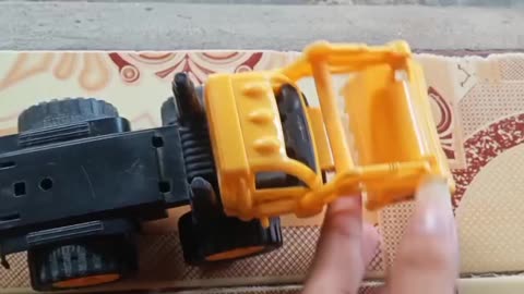 bouncy yellow bulldozer toy