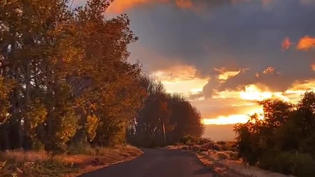 The clouds moving as fast as I am driving