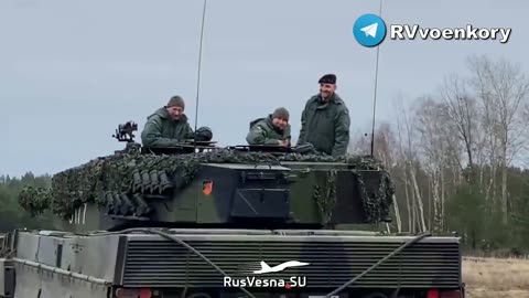 Ukrainian soldier perfoming the Nazi Salute while on Leopard 2 German tank in Poland