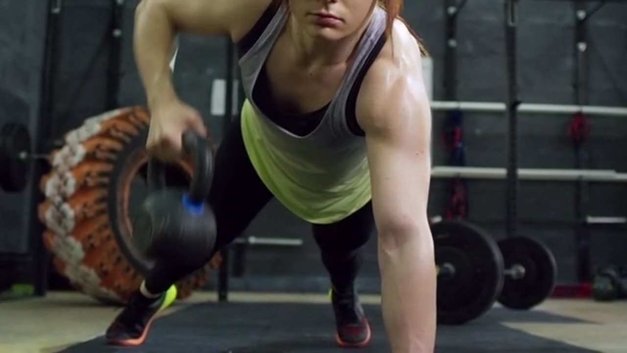 Woman Lifting Weight and Building Muscle