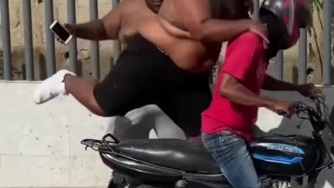 Two fats fight over motorcycle😀😀😀