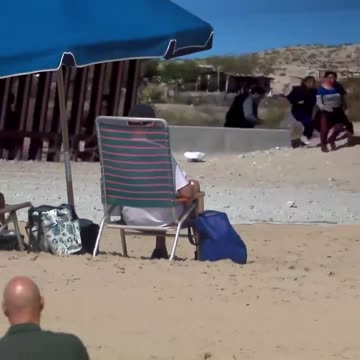 Crooked Joe vacations on the beach 🏖️ while they flood into the country 🌊🚶‍♂️