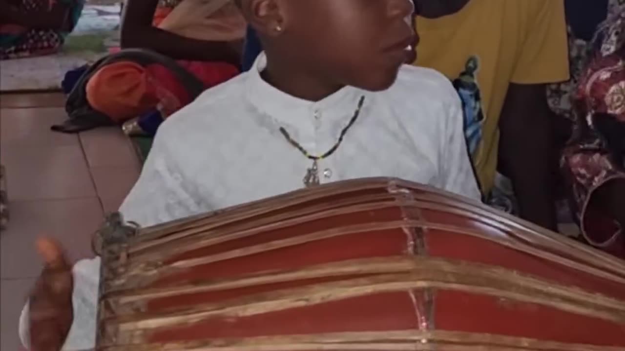 Talented young Mridanga player at Iskcon Benin in Benin city, Africa August 2024