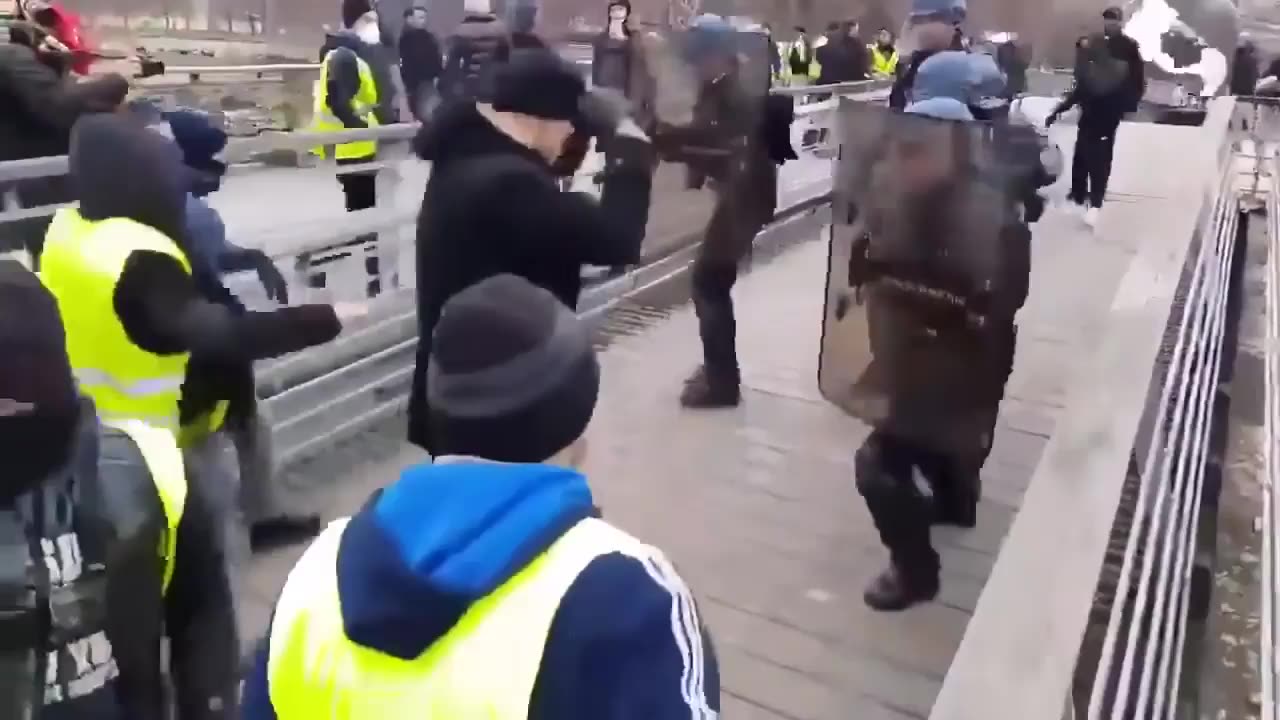 Former pro boxer takes on french riot police during protest. OLD BUT GOLD