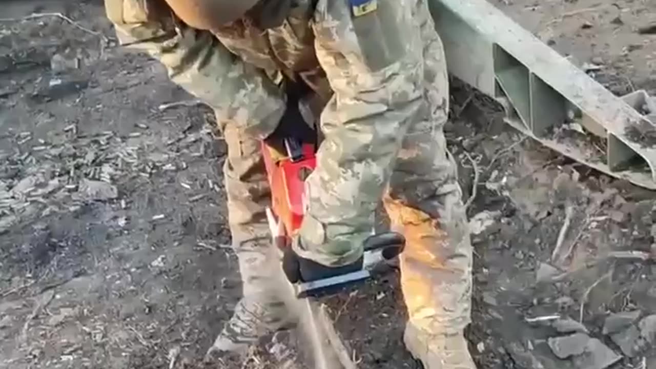 Cutting into the Frozen Ground with a Chain Saw