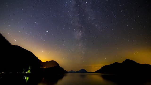 the colors of aurora in the sky on a starry night