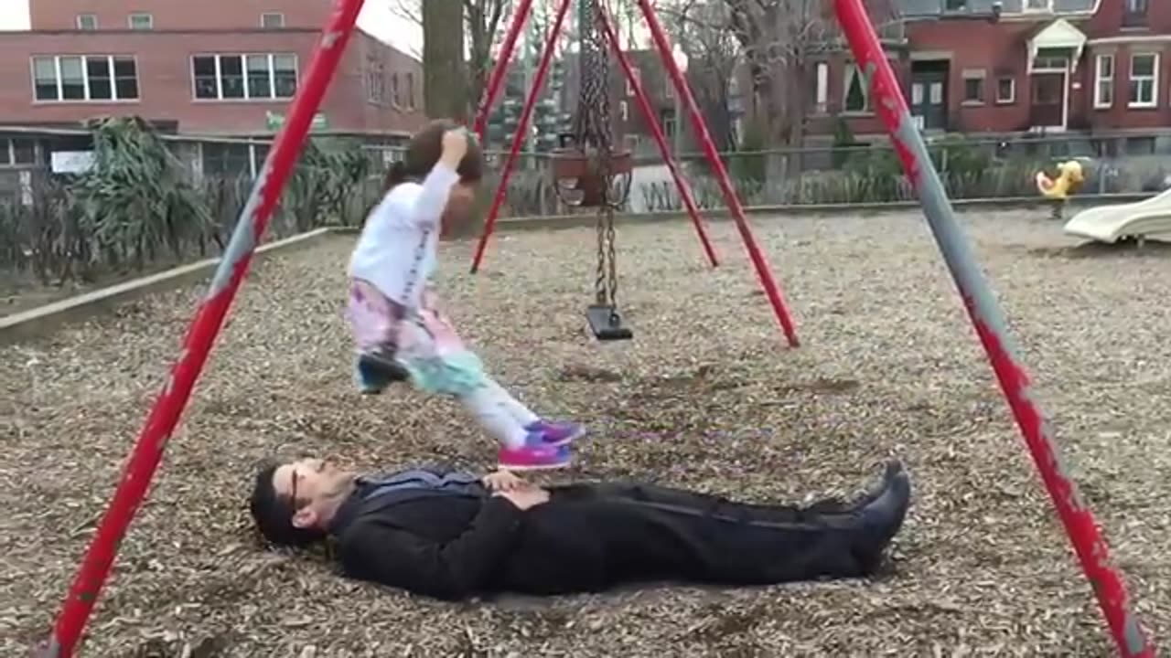 Awesome dad perfects swing stunt at the park