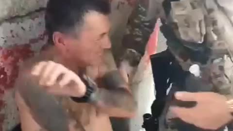 Russians captures a Ukrainian soldier covered in Nazi tattoos