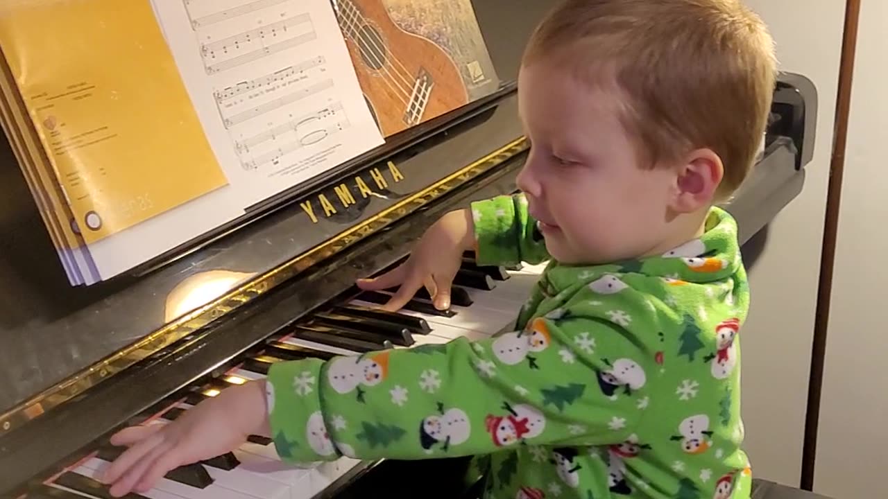 Our little Mozart wannabe playing